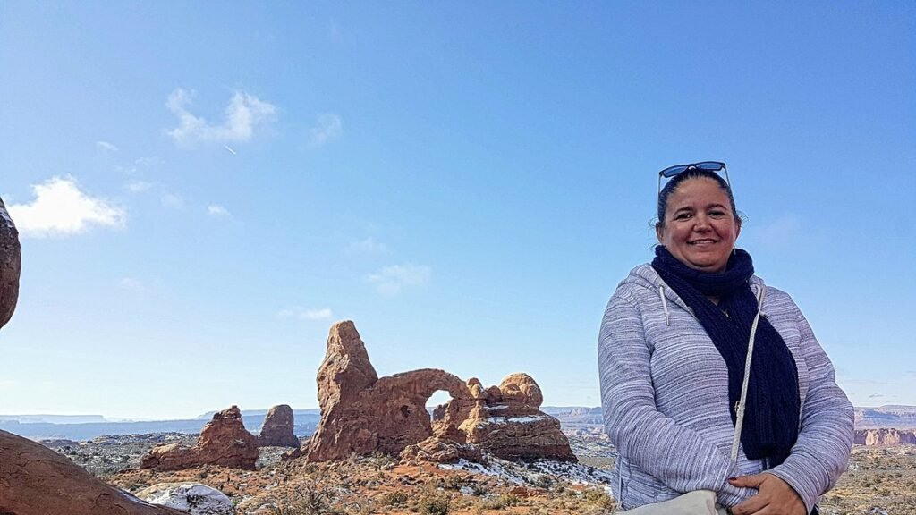Image of beccy at north window arch looking towards turret arch covered in snow