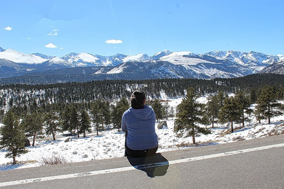 Image of a snowy landscape at Rocky Mountain National Park with a blue sky