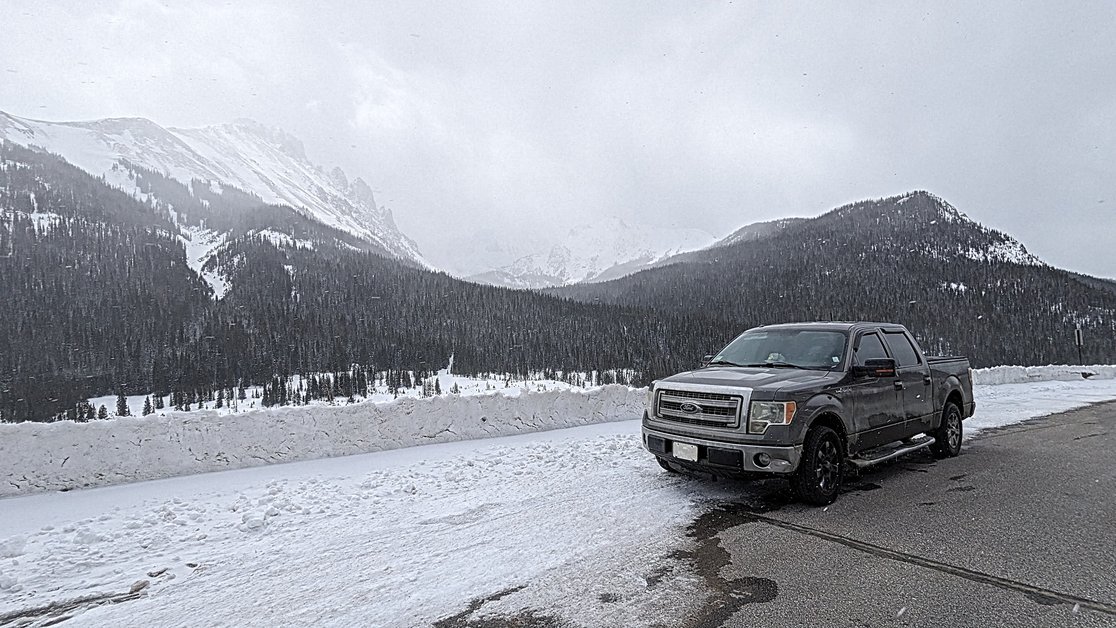 Image of snow-covered road leading to the Moose Visitor Center in Rocky Mountain National Park