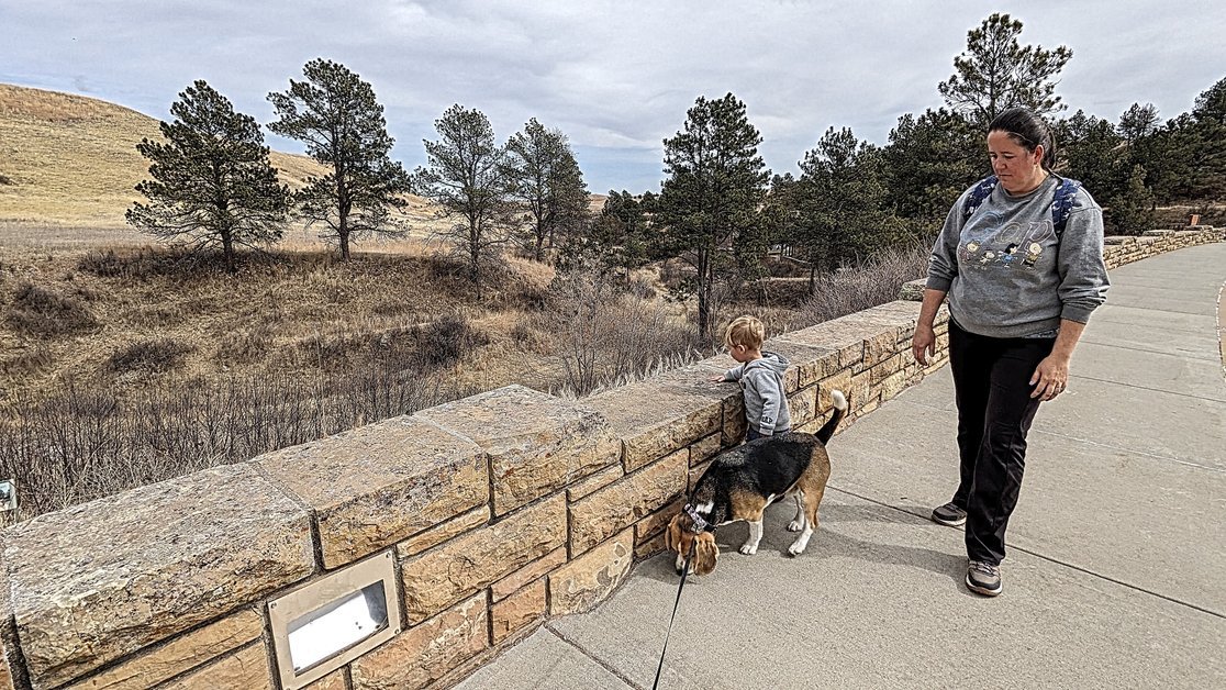 Family walking with dog on top of Wind Cave National Park
