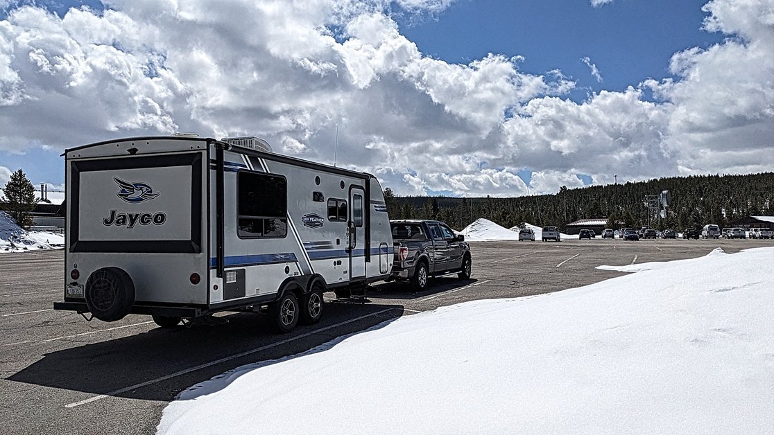 Truck F150 and Campervan Trailer at Old Faithful Geyser Park Visitor Centre